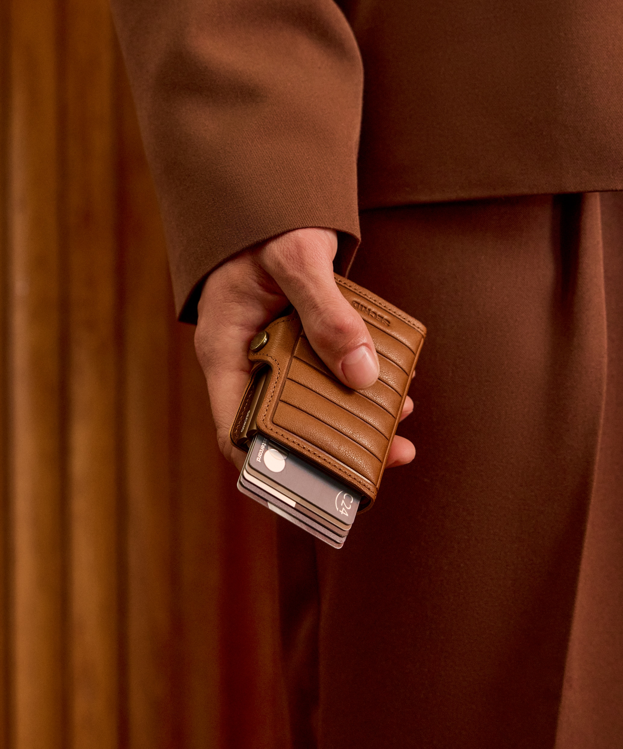 Real life image of the premium-twinwallet-emboss-lines-cognac-- wallet