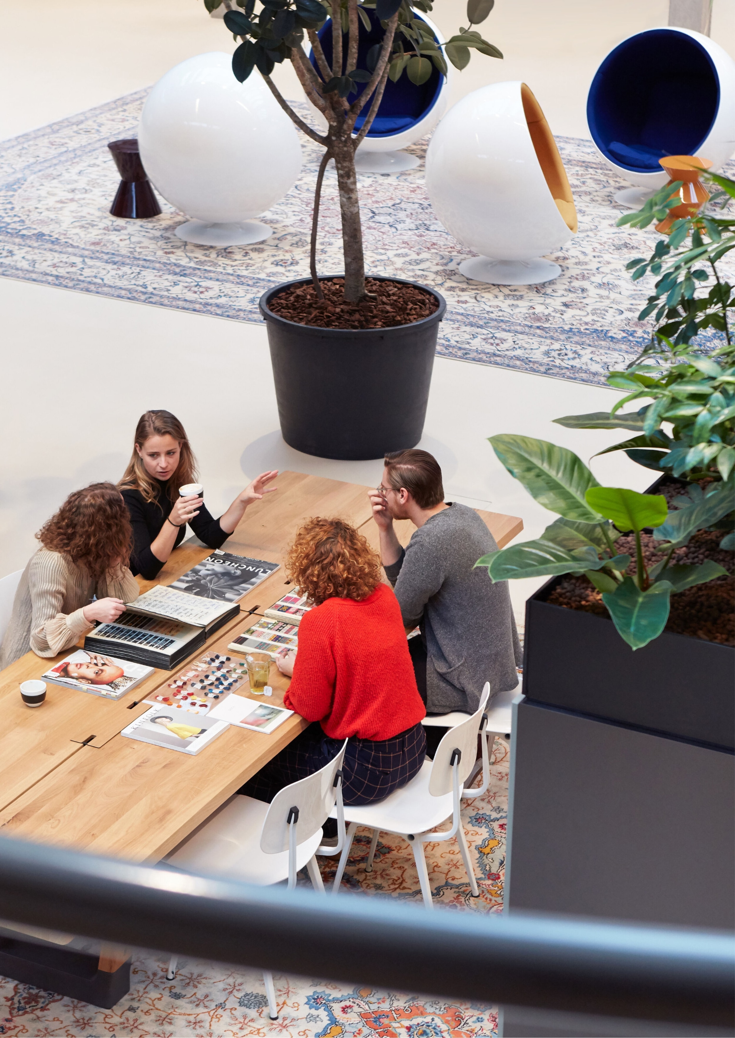 A bunch of people discussing ideas in a desk at Secrid office 