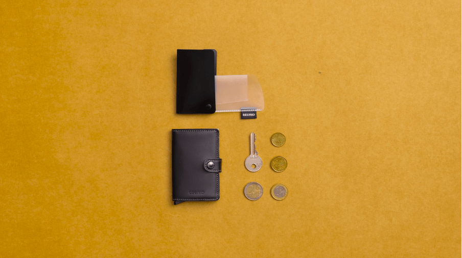 The Secrid coinpocket with some coins and a key